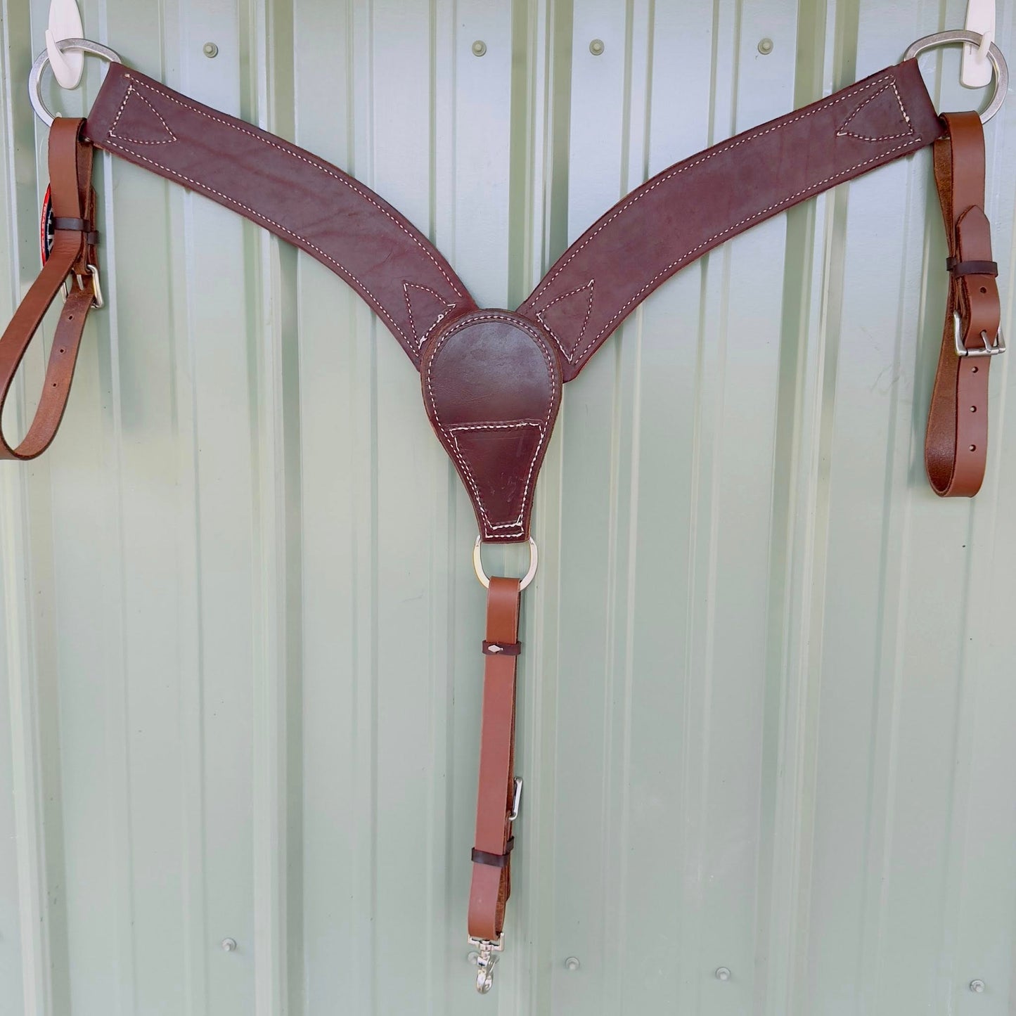 barbed wire breast collar – flat lay, medium-brown oiled leather