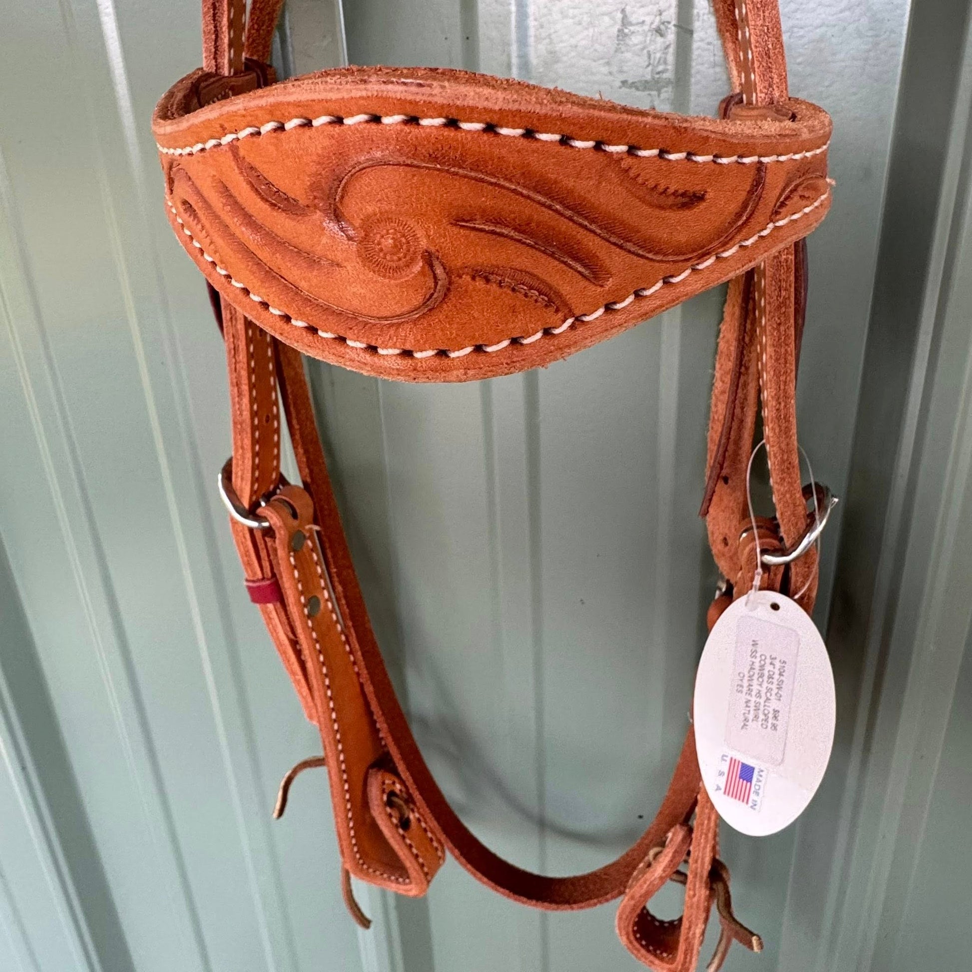 Close up of hand tooling swirl pattern