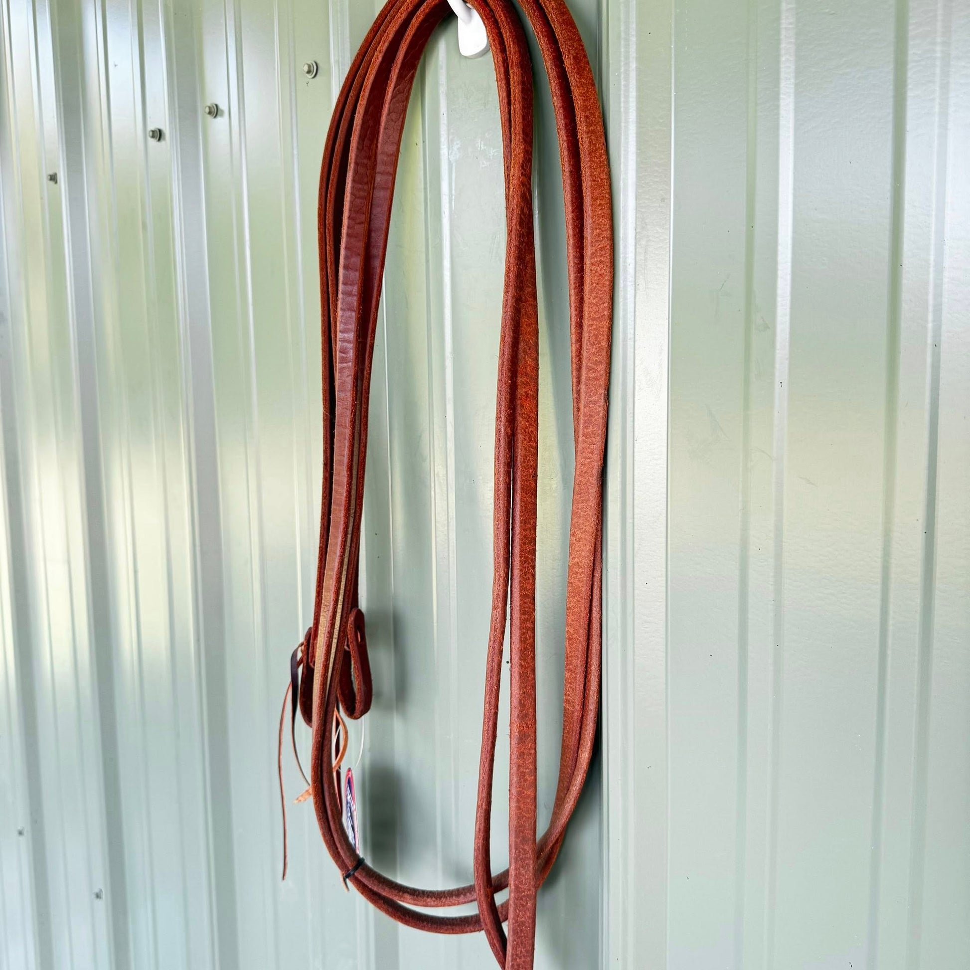 Split weighted reins 5/8 inch x 8 ft made from premium harness leather, oiled for soft feel and balanced control, handcrafted in the USA.
