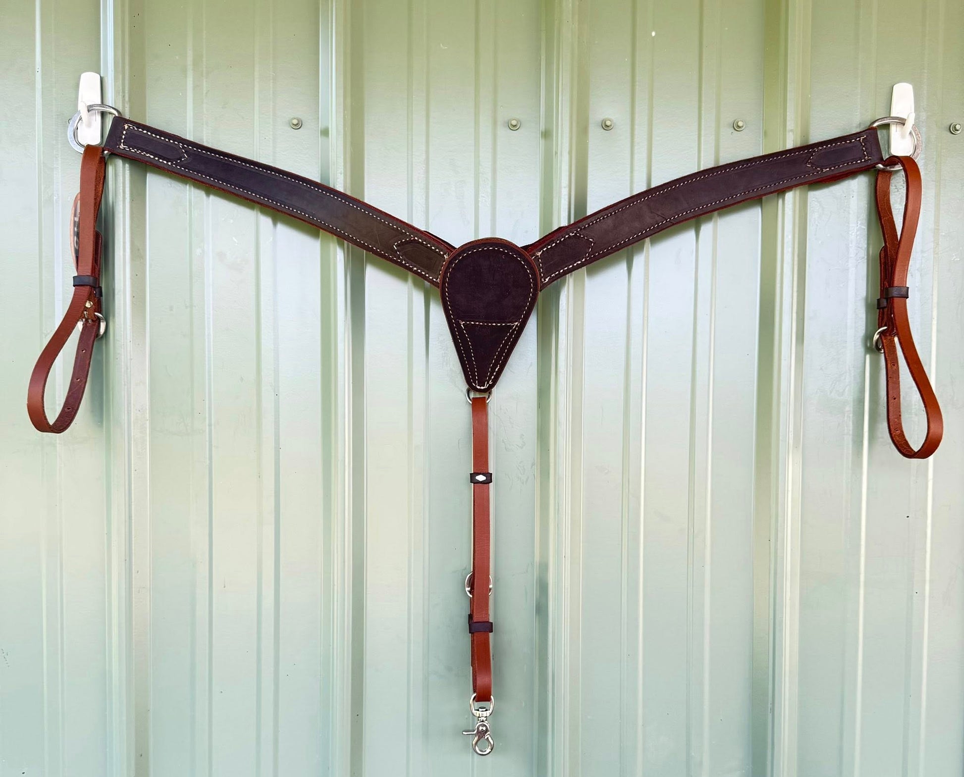 Stainless steel hardware on hand-tooled leather breast collar