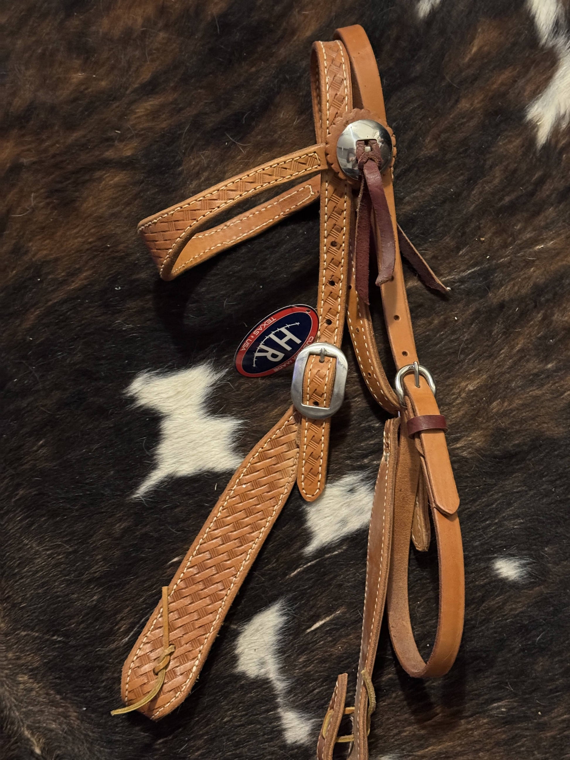 Close-up of basket weave tooling and stainless hardware