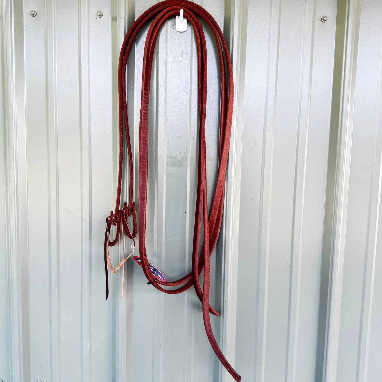 Split weighted reins 5/8 inch x 8 ft made from premium harness leather, oiled for soft feel and balanced control, handcrafted in the USA.