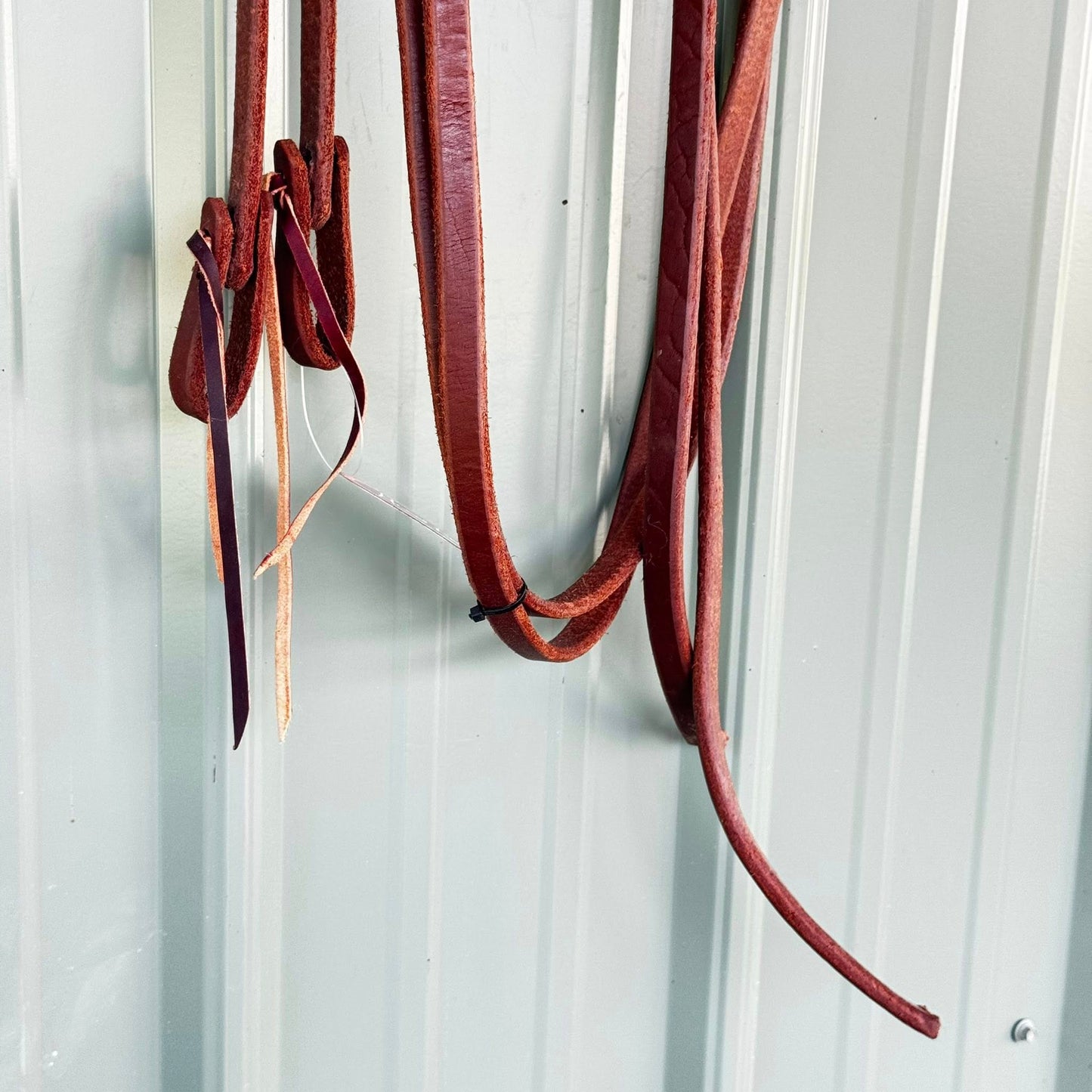 Split weighted reins 5/8 inch x 8 ft made from premium harness leather, oiled for soft feel and balanced control, handcrafted in the USA.