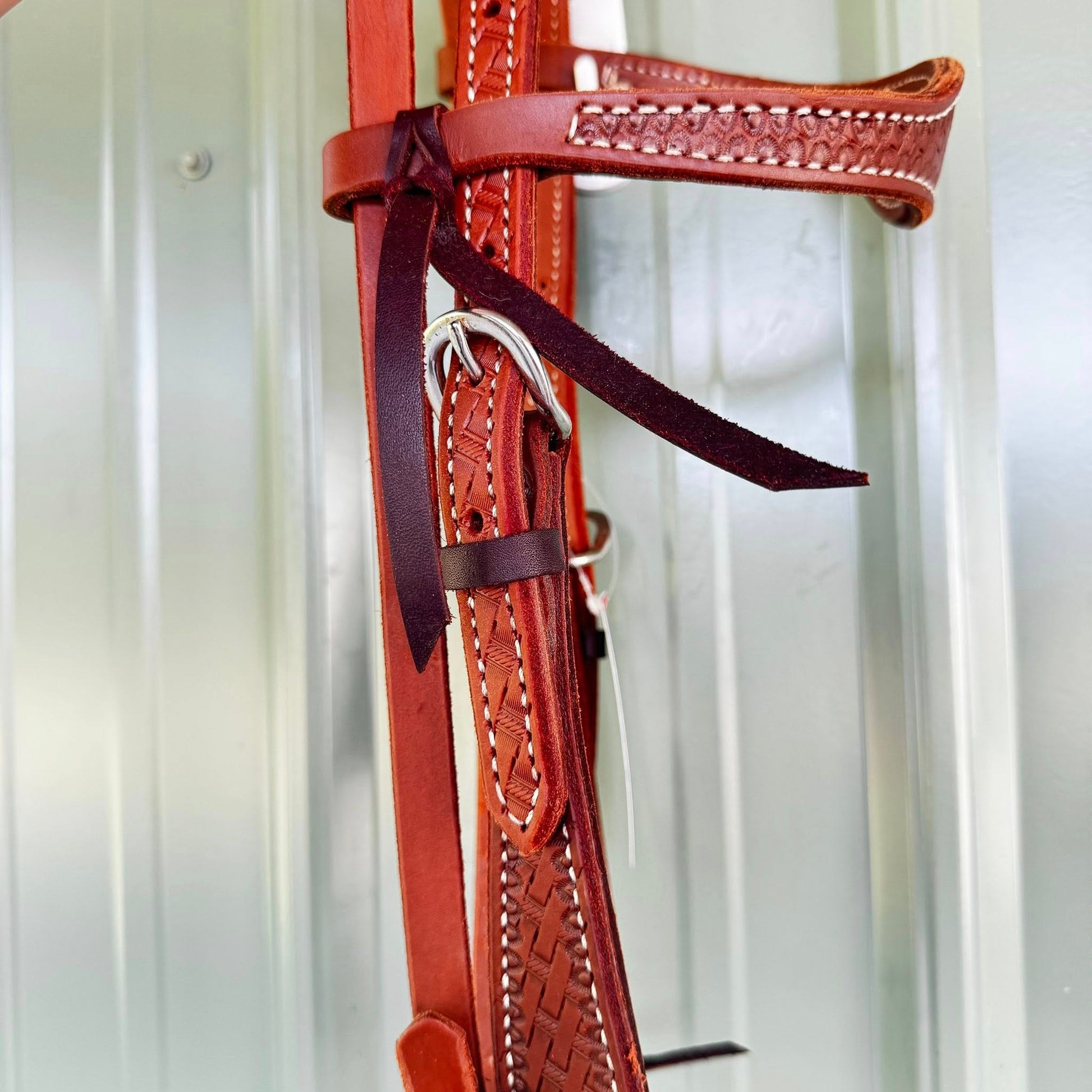 Soft oiled leather headstall with basket weave tooling and stainless hardware