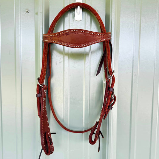 Hand tooled barbed wire cowboy headstall with scalloped browband and paddle cheeks