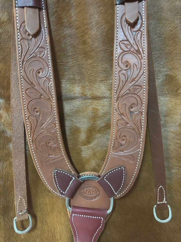 Heavy pulling breast collar with swirl hand tooling close up